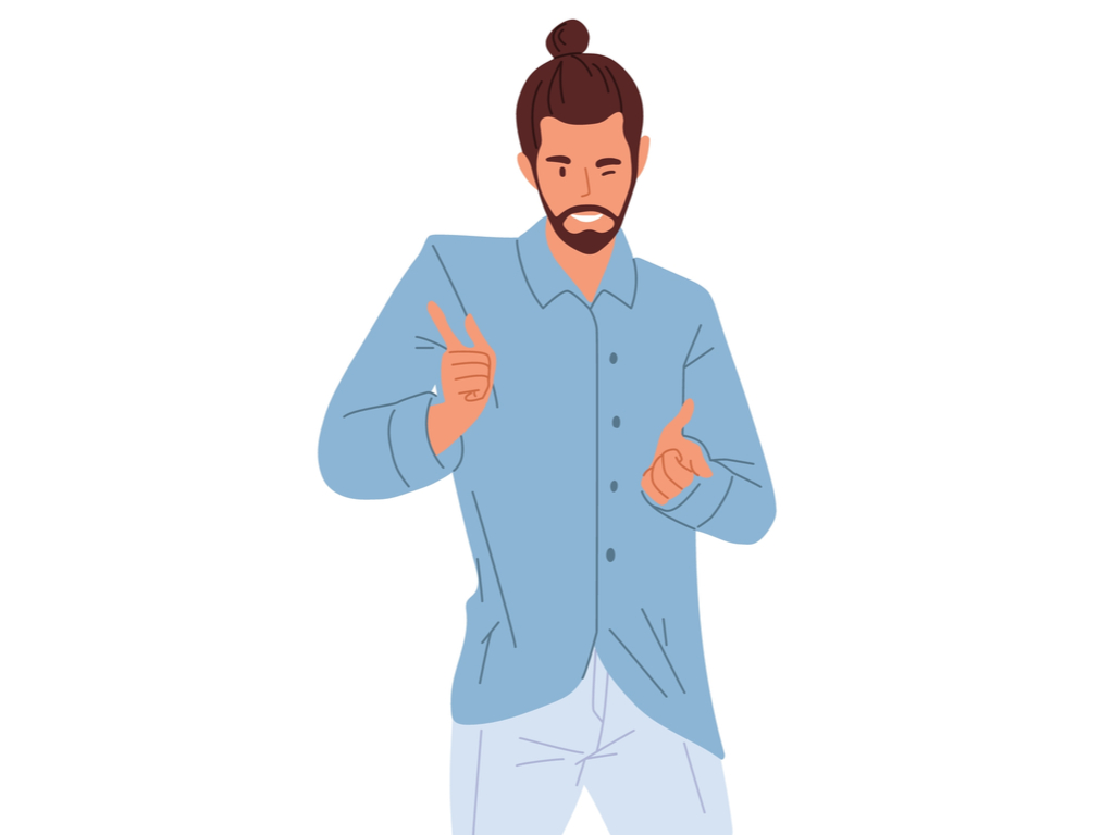 Man with a man-bun and beard wearing a blue shirt and light blue trousers winking while doing finger gestures.