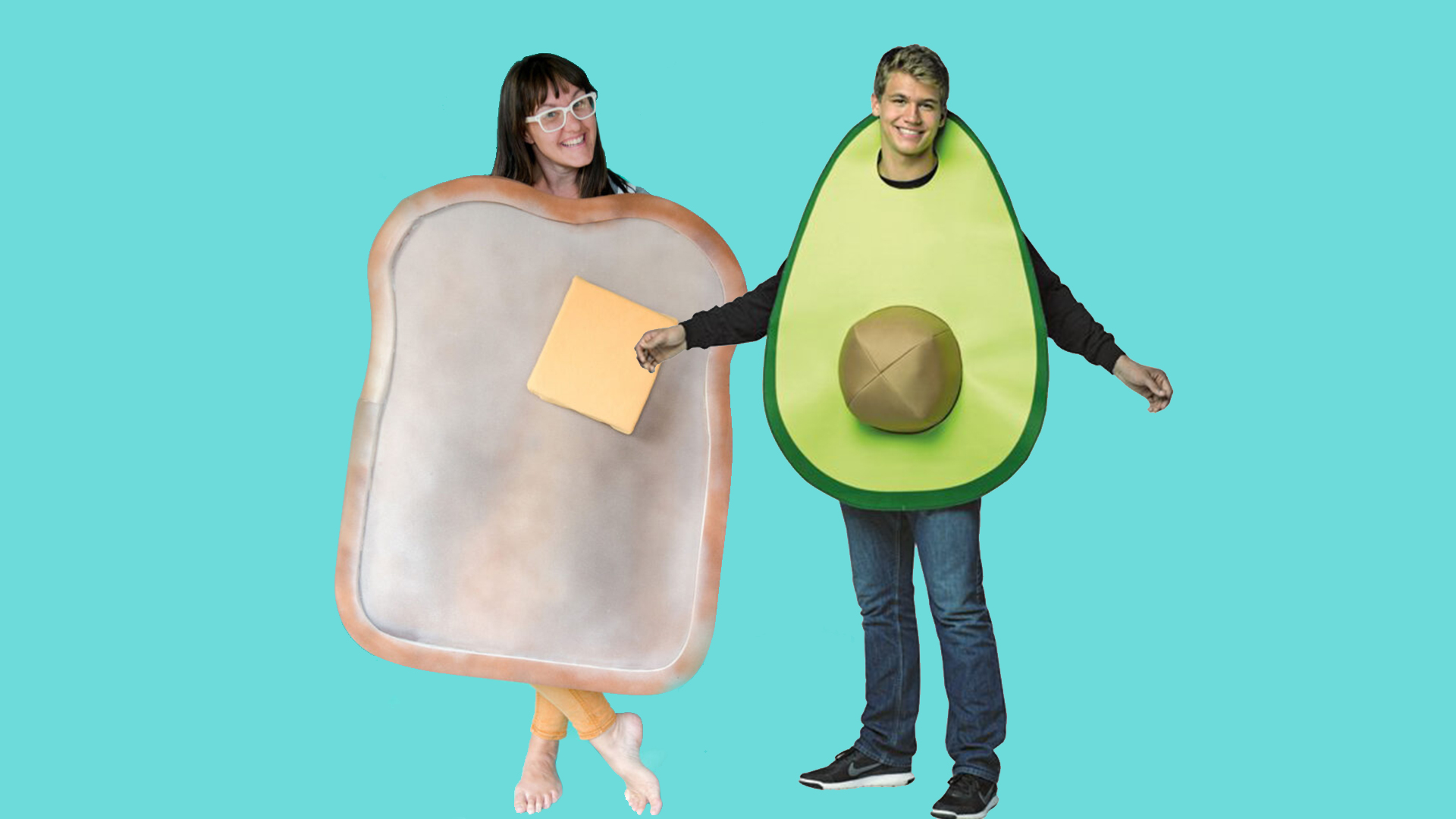 Woman dressed as toast and man dressed as avocado posing for a picture.